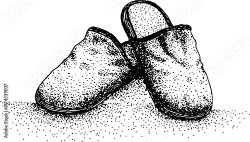 Soft slippers crossed with one tilted on dotted surface