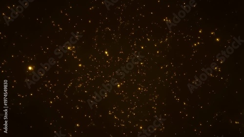 Golden sparkling particles on a dark background. Ideal for creating a magical atmosphere in videos, enhancing festive or celebratory themes