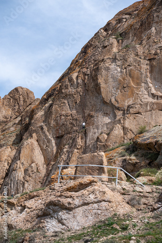 Majestic red rock formations and Buddhist petroglyphs site at Tamgaly Tas. Ili River landscape