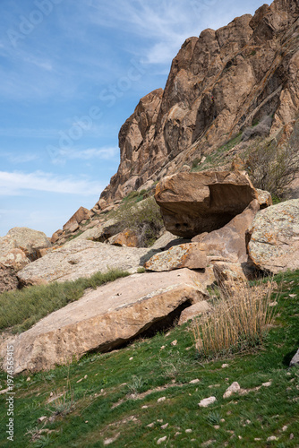 Majestic red rock formations and Buddhist petroglyphs site at Tamgaly Tas. Ili River landscape