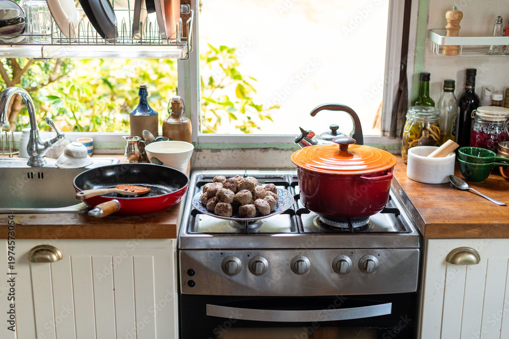 Naklejka premium Cozy kitchen with cooking essentials.