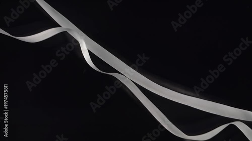 Grey ribbon on black background.