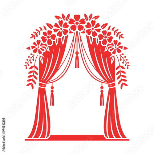 Red decorative floral archway with cascading curtains and tassels for wedding ceremony or special event entrance.