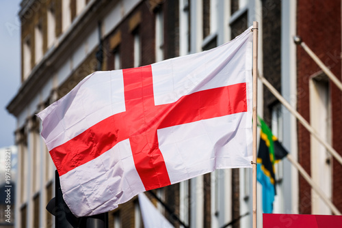 The flag of England waving in the streets of London.
