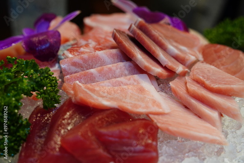 Close up of fresh red tuna akami and marbled otoro sashimi on ice