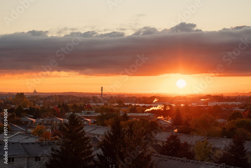 Bright orange sunset above distant horizon. 
