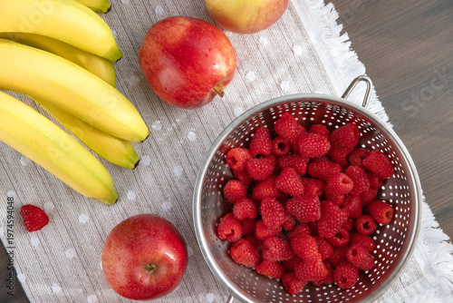 Fresh fruit arrangement with raspberries and bananas. 