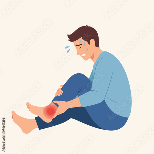 A man sweating and looking distressed while holding his injured, red swollen ankle