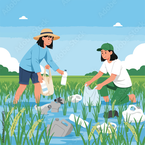Two volunteers collecting plastic waste from a flooded rice field for cleaning