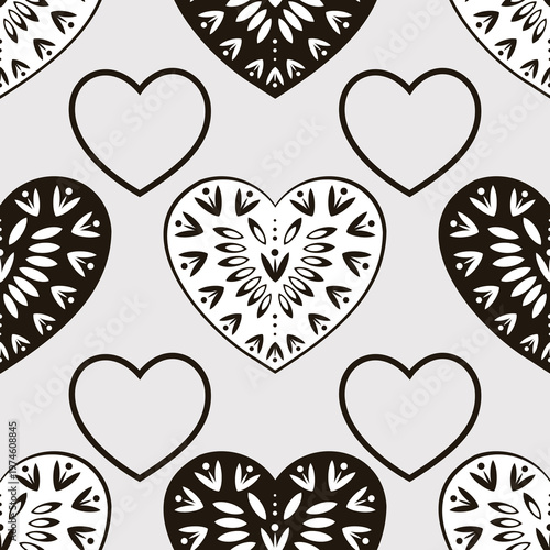 Fantasy black and white hearts on a gray background form a seamless pattern.