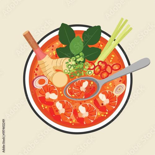 Overhead view of a bowl of spicy Thai shrimp soup with herbs and a silver spoon