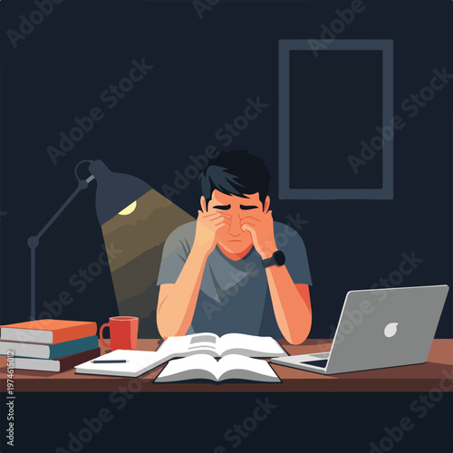 An exhausted student rubs his eyes while studying at a desk late at night