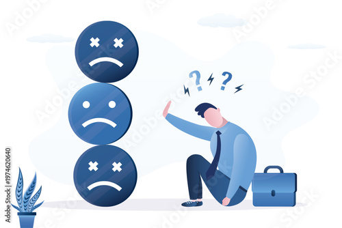 Depressed businessman sits on the floor next to briefcase, feeling burnout, overwhelmed by stress. He rejects stack of sad emoticons, representing mental health issues.