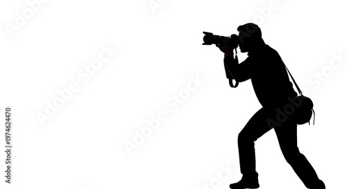 Silhouette of a photographer capturing a moment with a professional camera, isolated on white.