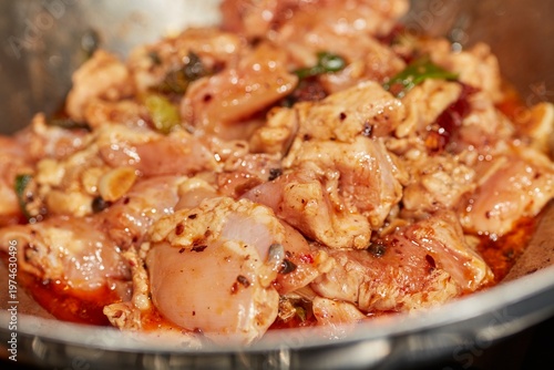 A batch of Big Plate Chicken cooking in a steel wok