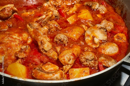 A pot of Chicken Murphy, a classic American bar food, simmering on the stove.