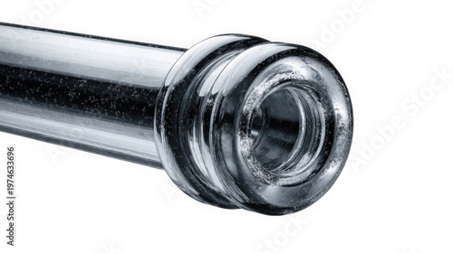 A close-up view of a shiny metal pipe with a threaded end on a black background