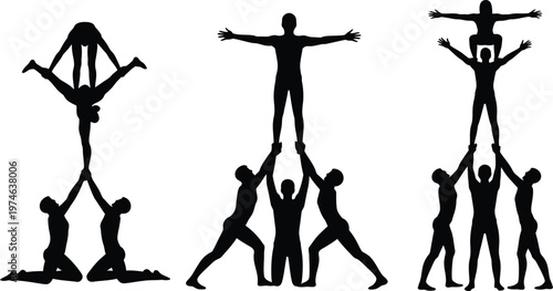 Black silhouette acrobats form impressive human tower formations.
