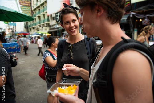 Photography Friends exploring vibrant street market.