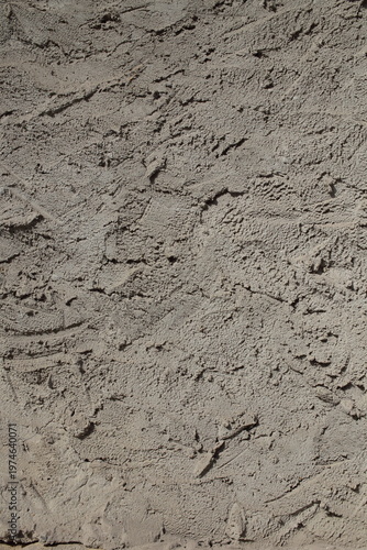 The plaster on the wall is not smoothed.