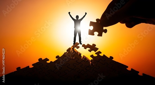 Silhouette of Person on Puzzle Peak Raising Arms at Sunset