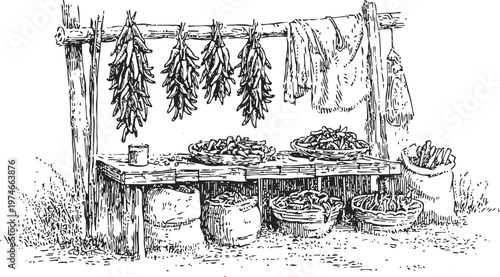 Rustic outdoor market stand with dried chili peppers hanging and baskets full of peppers for sale