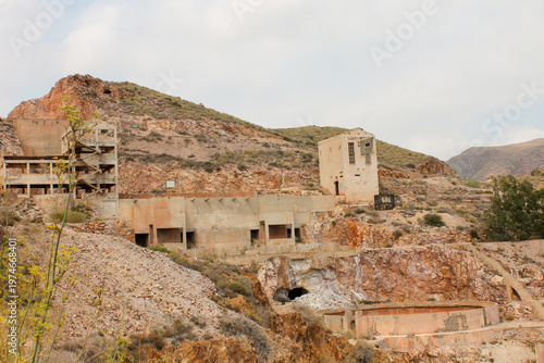 A striking shot of the decaying remains of an old gold mining complex in the arid hills of Nijar, Almeria. Crumbling concrete walls, and weathered industrial architecture