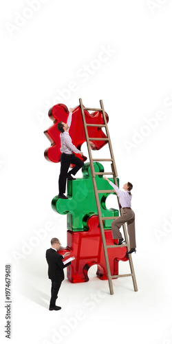 фотографія Business people climbing puzzle structure with ladder teamwork challenge