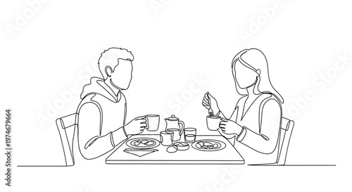 Man and woman eating at table.