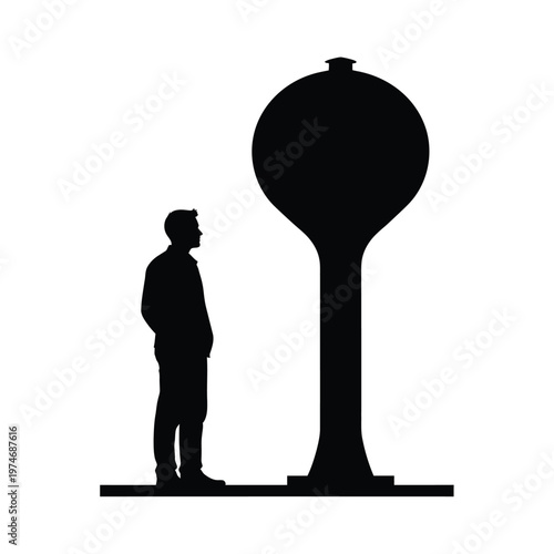 Silhouette of a person standing next to a large water tower