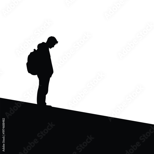 Silhouette of a person with a backpack standing on a sloped hill