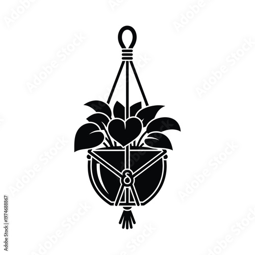 Black and white silhouette of a hanging plant in a macrame hanger