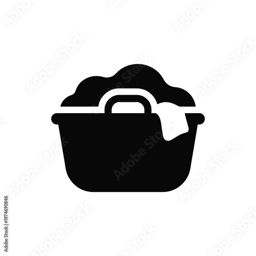 Black silhouette of laundry basket with clothes and handle
