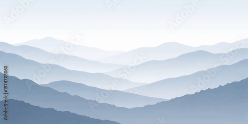 Misty mountain landscape with clouds over forest hills at sunrise