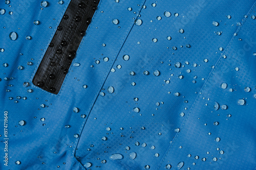 Konstfotografi Water droplets on blue waterproof material
