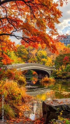 A serene autumnal scene with a bridge over a pond