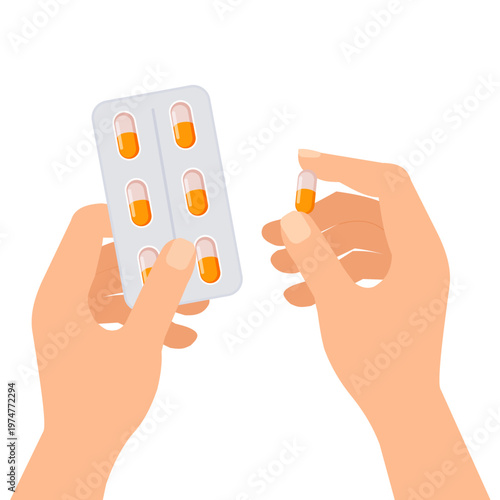 Hand holding blister pack of pills or vitamins and a single pill in the other hand 