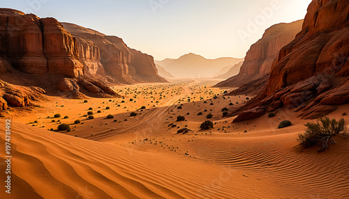 Majestic desert canyon with red sand dunes and rocky cliffs at golden hour