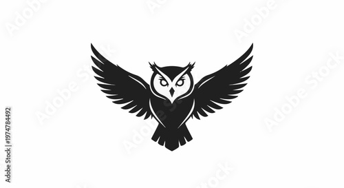 Black silhouette of an owl with wings outstretched