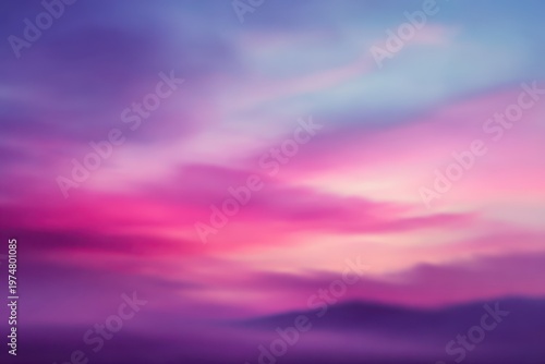 Vibrant Purple and Pink Hues Paint a Dramatic Sky Over Misty Mountains During a Serene Twilight