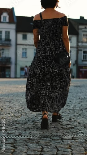 Young Attractive Woman, A Female Tourist, Walks Through The Historical Part Of A European City And Down An Old Street