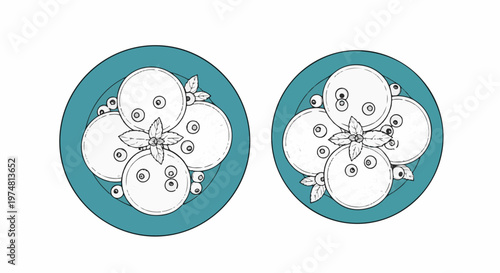 Two teal plates, each with round pancakes and berries, garnished with mint