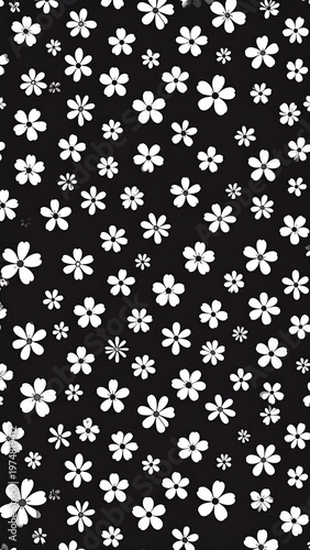 A stark, vertical arrangement presents white, stylized flowers against a black backdrop, creating a repeating, dotted-like pattern