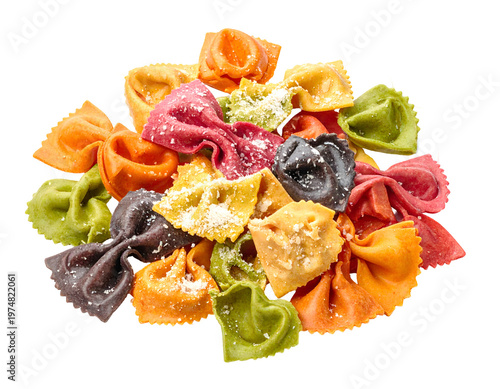 Colorful bowtie and filled pasta shapes with grated cheese