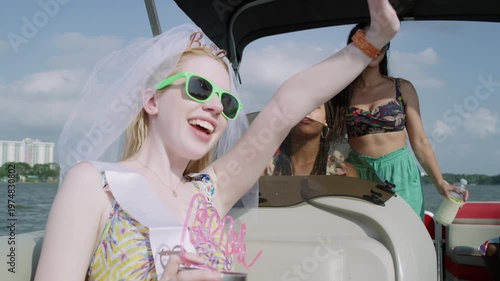 Wallpaper Mural A beautiful bride and her friends wave at someone off-screen as they ride on a boat. Torontodigital.ca