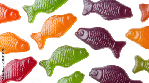 Colorful fish-shaped candies on a solid black background on transparent background