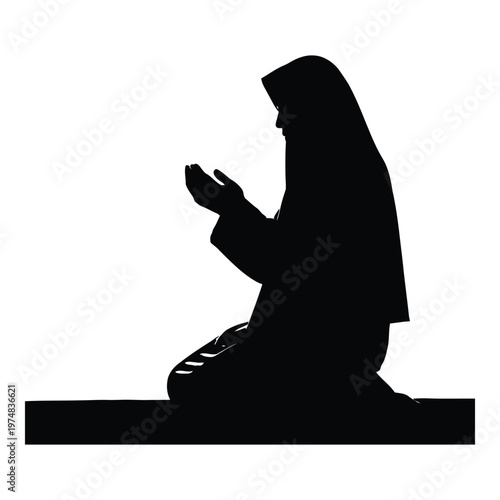 Silhouette of a Muslim woman wearing a hijab kneeling in prayer on a prayer mat with her hands raised in supplication representing devotion faith