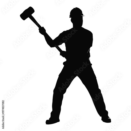 Silhouette of a construction worker wearing a hard hat and holding a large sledgehammer aloft preparing to strike with forceful intent representing manual labor