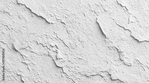 A textured white wall displaying a rough, uneven surface with visible patterns and layers.