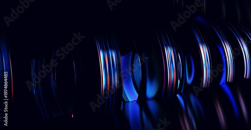 Foto Glass rings reflecting neon colors on black background